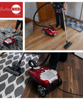 Heavy Duty HEPA Canister Vacuum Cleaner With 1400 Watt Variable Suction Motor And Three Stage Filtration cleaning hardwood floor.