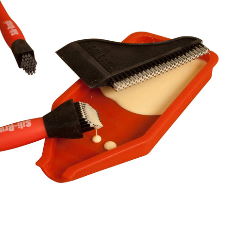 Non Stick Wood Glue Brush Silicone Applicator Kit with comb squeegee on red tray, glue visible on tray surface