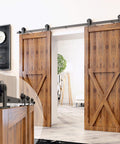 Front view of Black Rustic Sliding Barn Door Hardware Kit For Two Doors With 7ft Flat Track And T Shape Rollers Heavy Duty For Interior And Exterior Use Non Bypass Design, installed.