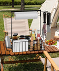 Outdoor Grill Caddy With Paper Towel Holder And Utensil Organizer on picnic table holding condiments and kitchenware
