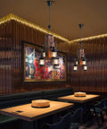 Industrial Vintage Wooden Hanging Pendant Light With 4 Bulbs Dope Retro Loft Lantern Chandelier in coffee shop setting
