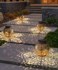 Outdoor Solar Lanterns With Cute Owl Cutouts Two Pack Waterproof Garden Decor illuminating pathway at dusk