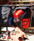 Welding Backpack With Detachable Helmet Bag And Built In Lunch Tote For Easy On The Job Site Storage Of Welding Gear Ultra Durable Tool Carrier With Padded Back And Straps Red and black backpacks on stairs with gear.