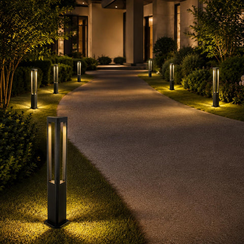 Modern Black LED Pathway Lights Sleek Cone Bollards illuminating a curved path in a garden setting with warm glow.