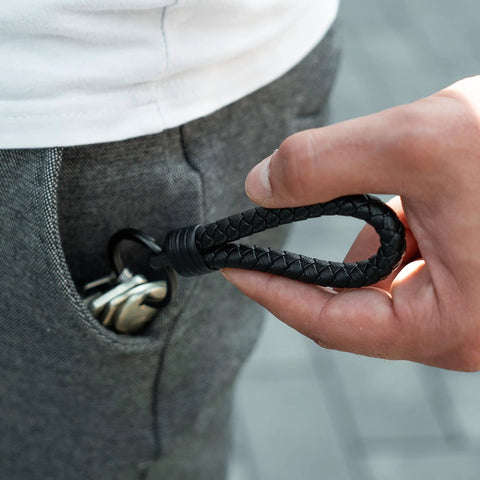Premium Leather Keychain With Stainless Steel Ring And Extra Key Rings visible in hand, attached to pants pocket.
