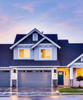Modern house exterior at dusk showcasing Two Pack LED Square Up And Down Outdoor Wall Lights Aluminum Weatherproof Sconces lighting.