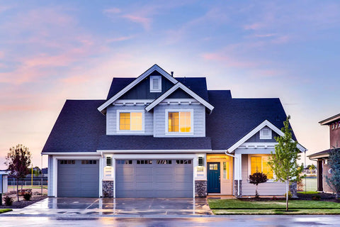 Modern house exterior at dusk showcasing Two Pack LED Square Up And Down Outdoor Wall Lights Aluminum Weatherproof Sconces lighting.