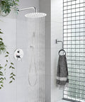10 Inch Round Rainfall Shower System With Wall Mount High Pressure Shower Head Set Rough In Valve And Cylindrical Handheld Spray In Polished Chrome All Metal SUS304 Stainless Steel Construction Built Tough installed in modern bathroom