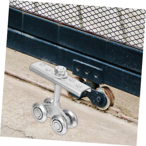 Close-up of Heavy Duty Sliding Door Roller Kit With Galvanized Track Pulley, installed on industrial gate under track.