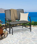Outdoor Glider Bench For Patio And Backyard With Steel Frame That Handles 400 Lbs Two Person Loveseat Swing Rocker Great For Poolside Lawn Balcony And Porch Hangouts Gray on stone patio by sea