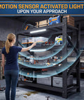Woman using Heavy Duty 4 Tier Metal Garage Storage Shelving Unit With Beefed Up Reinforced Frame For Maximum Stability And High Capacity