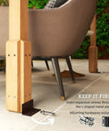 Close-up of concrete anchors securing a post for Six Point Six Foot By Six Point Six Foot Outdoor Pergola Kit with Built To Last Concrete Anchors And A Sturdy Frame Wood Gazebo Grape Trellis For Climbing Plants Hangout Ready Garden Patio Backyard Or Deck Dark Brown.