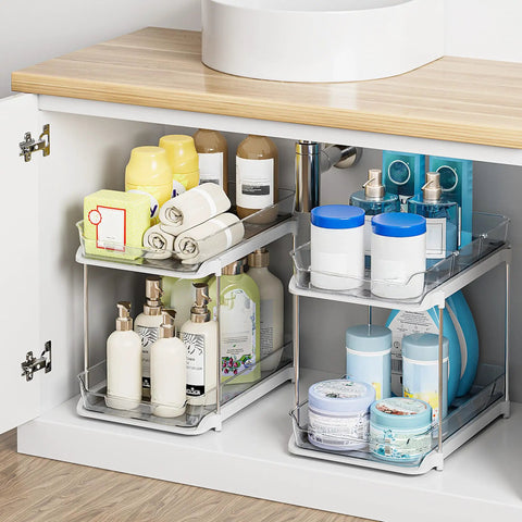 Super Handy Two Tier Under Sink Organizers And Bathroom Storage Solutions For Cabinets And Kitchen Pantries With Smooth Slide Out Drawers And Fully Adjustable Dividers In Bright White Two Pack displaying toiletries and towels.