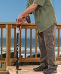 Person using a power tool on a deck with Pro Level Heavy Duty Collated Bugle Head Wood Screws 10 X 3 Inch Square Drive.
