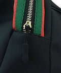 Close-up of Black Nylon Zipper Pulls 10 Pack With Non Slip Gripper Two And A Half Inch Universal Zipper Tabs on coat