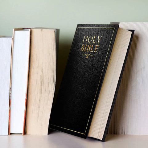 Hidden Bible Safe Box With Combination Lock For Discreet Stash resting among real books on a bookshelf