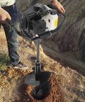 Beast 72cc Gas Powered Post Hole Digger With 4.1HP Heavy Duty Earth Auger in use for digging, showing auger and engine