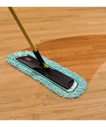 Heavy Duty 36 Inch Green Microfiber Dust Mop Pad With Extra Long Fringe For Pro Janitorial Jobs And Hard Floor Sweeping on wooden floor.