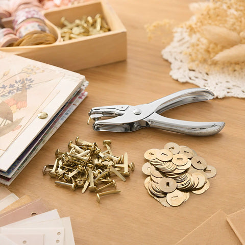 All In One Paper Fastener Kit With Hole Punch Tool And Golden Brads For Crafts, Scrapbooking, And Card Making, 100 Pcs Metal Fasteners, Smooth Paper Piercing, Easy Setup on wooden desk