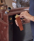 Person applying Boss Level Liquid Epoxy Adhesive For Ultimate Waterproof Fixes And Leak Plugging With Six Thousand Psi Anchor Hold.