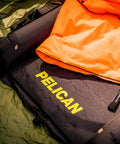 Self Inflating Sleeping Pad With Pillow And Arm Rest For Camping Waterproof Foldable Lightweight Air Mattress With Memory Foam Core And R Value 5.2 For Hiking And Backpacking in camping setup with orange sleeping bag.