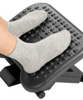 Adjustable Ergonomic Desk Footrest With Massage 3 Height Positions And 30 Degree Tilt Under Desk Foot Stool in use with socks