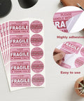 Hot Pink Fragile Stickers For Shipping Do Not Bend Do Not Crush Handle With Care Labels Pack Of 500 shown with adhesive backing
