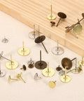Top 50 Pack Flat Head Upholstery Thumb Tacks Rock Solid Iron Push Pins For Wooden Furniture Wall Paneling And Home Improvement Projects, assorted sizes and colors on fabric.