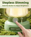 Close-up of Kids Lantern With 4 Color Dimmable Lights And USB C Charging showing dimming button operation in green setting.