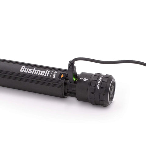 Close-up of black Beefed Up 2000 Lumen Rechargeable Flashlight for Outdoor Adventures with charging cable attached.