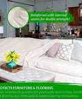 All Purpose Canvas Drop Cloths For Painting And Renovation Heavy Duty Floor Cover Protects Furniture And Surfaces 14x16 Inch Canvas Tarp covering a sofa in a living room.