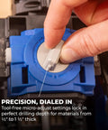 Close-up of hand adjusting Rebel 20V Ionic Drive Pocket Hole Joiner Kit with micro-adjust tool-free settings for precision.