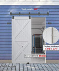 Five Foot Exterior Sliding Barn Door Hardware Kit Built Tough Heavy Duty Track System For Indoor And Outdoor Doors Wall Mount Black Galvanized Steel With Weatherproof Floor Guide installed on blue wall