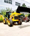 Towable Mini Digger For Demolition Tasks And Farm Projects, yellow excavator with front loader, parked outdoors, ready for use.