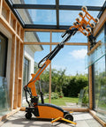 Hardcore Electric Glass Vacuum Lifter With Wireless Remote lifting glass pane indoors with suction grips on wheeled base.