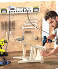 10 Outlet Power Strip With LED Work Light And 4 Foot Cord, Heavy Duty Metal Wall Mount, Ideal For Workshop, Garage, Office And Home, ETL Listed, 15A 125V 1875W Capacity, mounted on a wooden wall with tools nearby.
