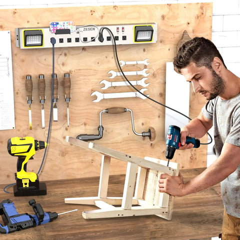 10 Outlet Power Strip With LED Work Light And 4 Foot Cord, Heavy Duty Metal Wall Mount, Ideal For Workshop, Garage, Office And Home, ETL Listed, 15A 125V 1875W Capacity, mounted on a wooden wall with tools nearby.