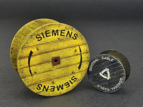 1 35 Scale Cable Spool Model Kit With Decals, Unpainted Plastic Assembly featuring yellow and black spools on dark background