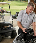 Mechanic installing Drop In Rpm Rev Limiter Fits Club Car Ds And Precedent Gas Golf Carts 1997 Up with Fe290 Fe350 Kawasaki Motor.