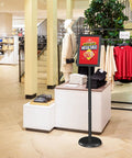 Sign Holder Floor Stand 8.5x11 Inch With Adjustable Height And Tilt Heavy Duty Base Snap Open Frame Display in clothing store