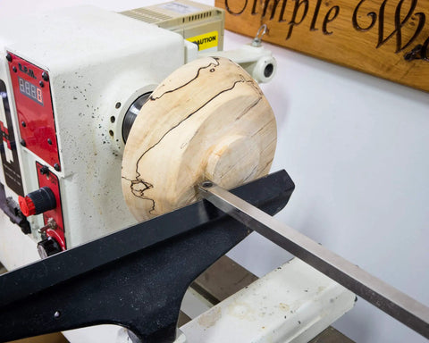 American Made Vacuum Chuck For Wood Turning Lathe With 1 Inch By 8 TPI Threads CNC Machined Aluminum holding a wooden bowl