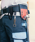 Close-up of Heavy Duty Tool Belt Clips Six Pack For Securely Holding Your Hammer Drill Power Tools And Electrical Rig Upgrades, attached to canvas belt.