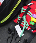 Oral And Nasal Airway Roll Kit With Six OPAs And NPAs Six Lube Packs CPR Mask Roll Bag Laid Open On Scene For First Aid Response