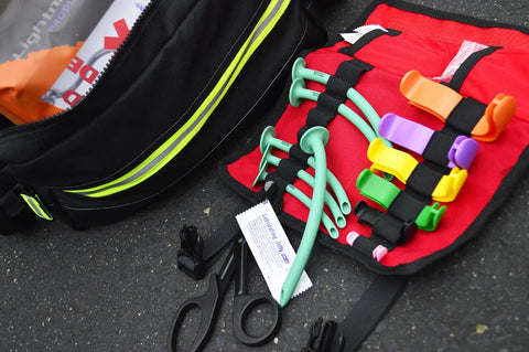Oral And Nasal Airway Roll Kit With Six OPAs And NPAs Six Lube Packs CPR Mask Roll Bag Laid Open On Scene For First Aid Response