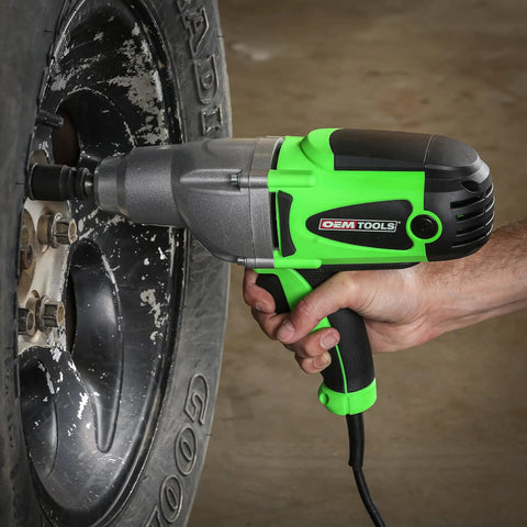 Person using Beast Half Inch Corded 120 Volt Impact Wrench on car tire for lug nut removal with 400 foot pounds torque