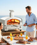 Man using Portable Gas Pizza Oven with 15 Inch Stone, Stainless Steel Backyard Tailgate Ready Pizza Maker, Dual Side Burners 23K BTU, Heats To 750F