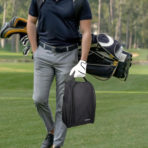 Golf Shoe Bag With Zipper Pocket And Padded Carry Strap For Easy On The Go Golf Gear held by golfer on course