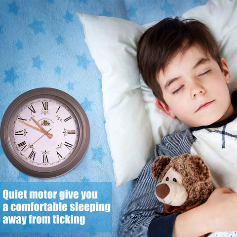 Child sleeping next to a wall clock with a message about a quiet motor that provides a comfortable sleeping environment.