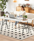 Woman working at Six Foot Folding Table For Indoor And Outdoor Use Portable Picnic Party Table With Carrying Handle Fold In Half Design Lightweight White Plastic Perfect For Parties BBQs Weddings Camping And More in a cozy living room setting.