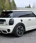 Rear view of a white MINI Cooper showcasing the MINI Cooper Stubby Jr Antenna 2 Inch Short Antenna Replacement For 2001 To 2026 Cars